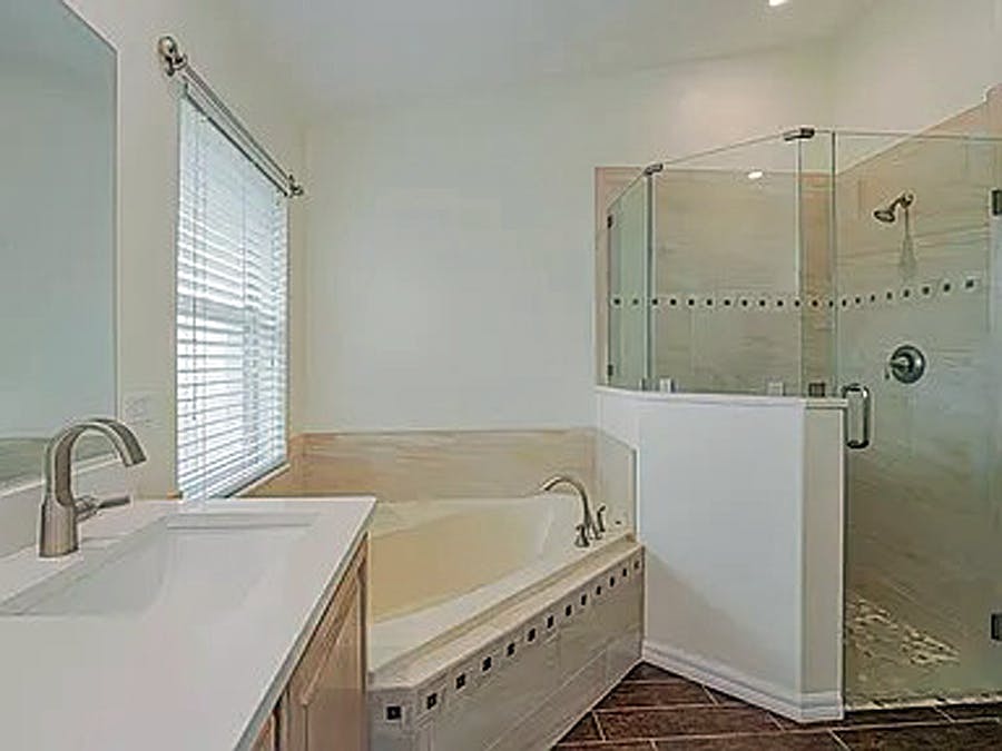 Primary bath with soaking tub and large walk-in closet